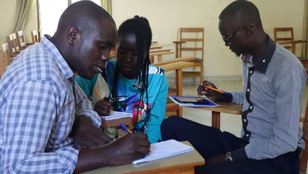 Joyce Samte (Center) with colleagues during AHAPPY ToT Catholic Diocese of Homabay discussing on how they youth can be at the forefront in addressing issues on HIV and drug abuse.