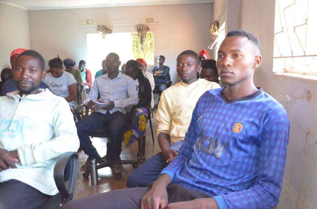 Some of the young people follow proceedings during entrepreneurial training in pig production